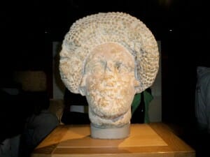 Head statue dating to 1st Century CE inside Roman Bath