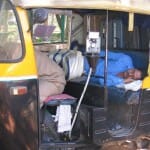 rickshaw driver taking a nap in Bangalore