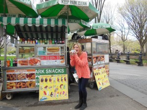 Kayla Garthwaite eating a hot dog in Central Park