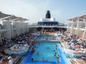 Pool Deck with dance class in background aboard the Celebrity Reflection