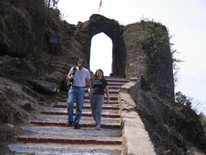 Sandy and Ira walking down steps of Sinhagad Fort