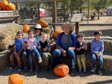 Sandy and Ira Bornstein and 5 of 6 grandchildren at a pumpkin patch October 2021
